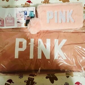 Pink wallet and traveling duffel bag